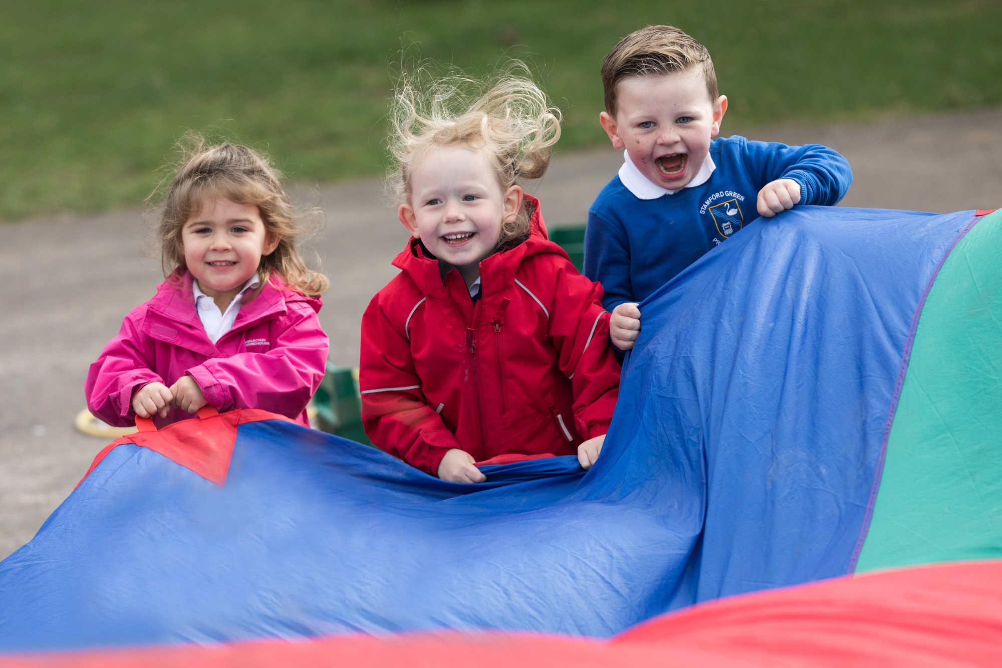 Children playing with parachute