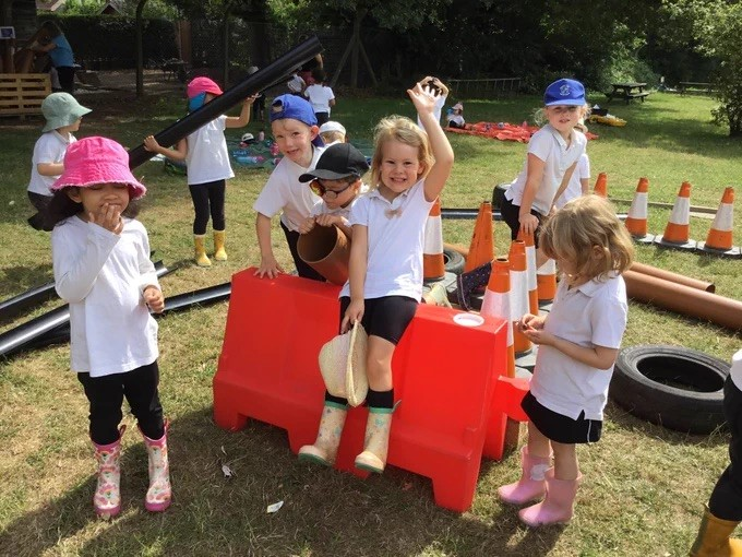 Children playing on plastic play equipment