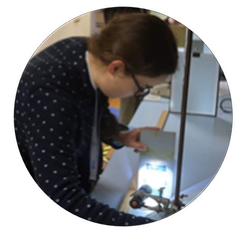 Girl leaning over an experiment