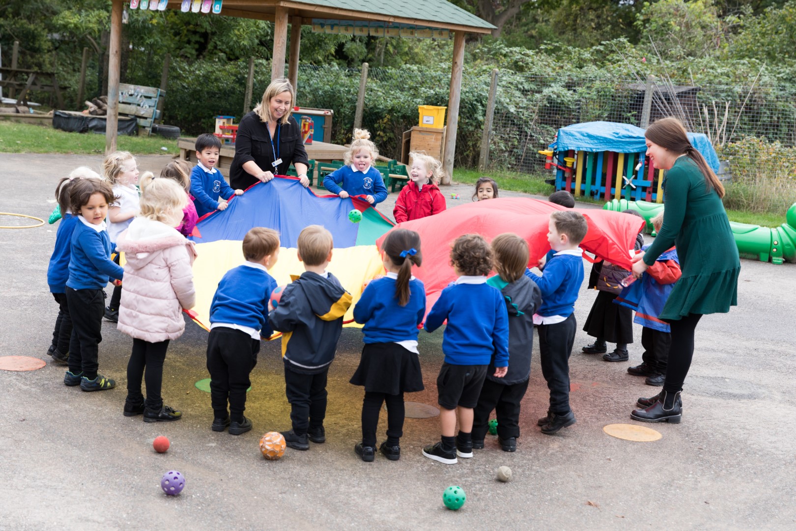 Children playing with parachute