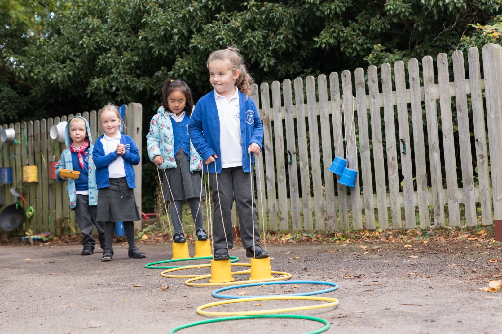 A group of children playing on stilts